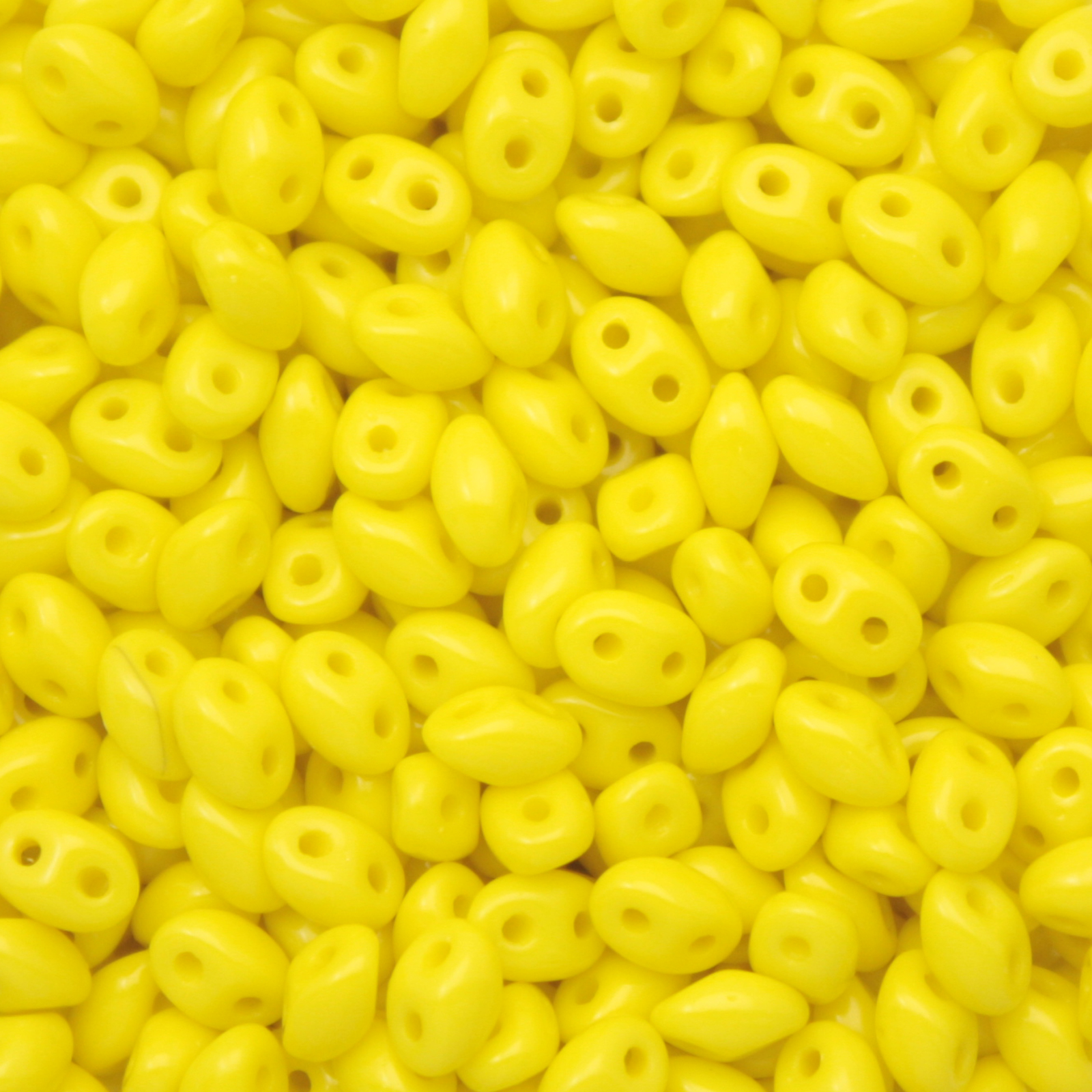 pressed twin beads opaque yellow 5x2,5mm | 20gr