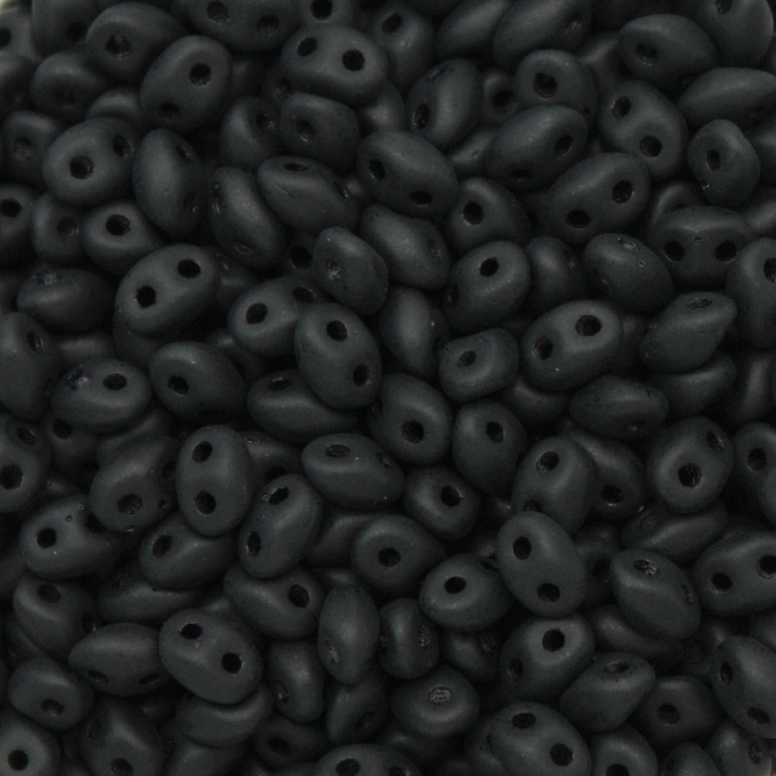 pressed twin beads matte jet 5x2,5mm | 20gr